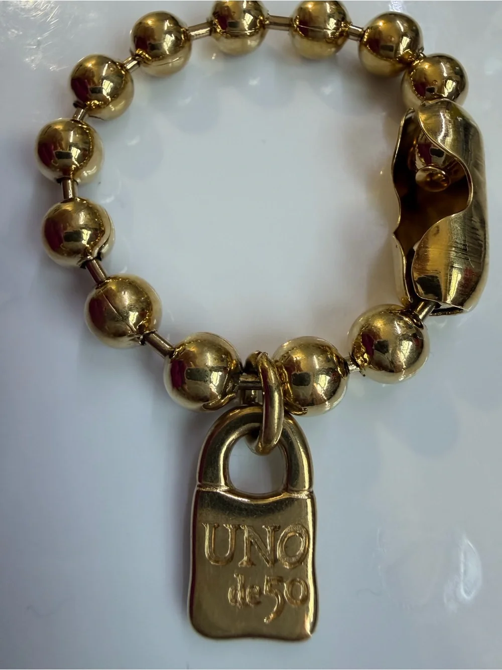 UNO de 50 Gold-Tone Beaded Bracelet with Padlock Charm